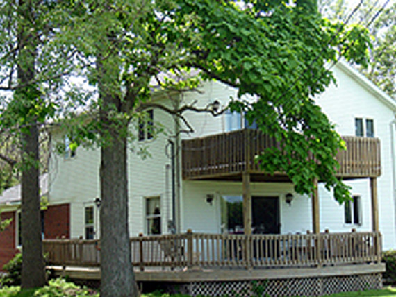 the exterior of the six-bedroom rental home at Tall Timbers
